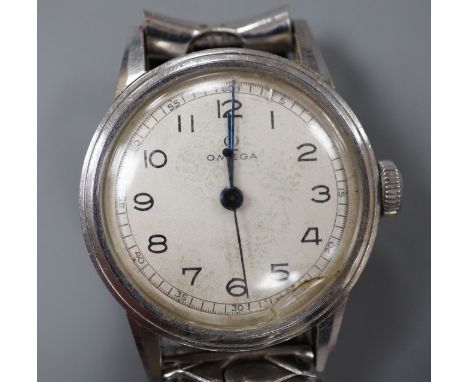 A gentleman's early 1940's mid size stainless steel Omega manual wind wrist watch, with Arabic dial, case diameter 31mm, on a