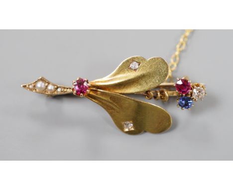 An Edwardian yellow metal, ruby sapphire, seed pearl and diamond set leaf brooch, 39mm, gross weight 4 grams.