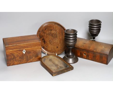 A George III inlaid mahogany tea caddy, a Victorian satinwood and rosewood domed topped glove box, a burr wood circular tray,