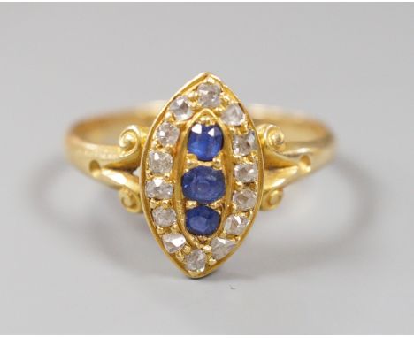 An early 20th century yellow metal, sapphire and diamond set marquise shaped cluster ring, with split shoulders, size R, gros