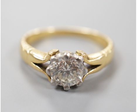 An 18ct and plat set solitaire diamond ring, size F, gross weight 2.9 grams, the stone weighing approx. 0.60ct.
