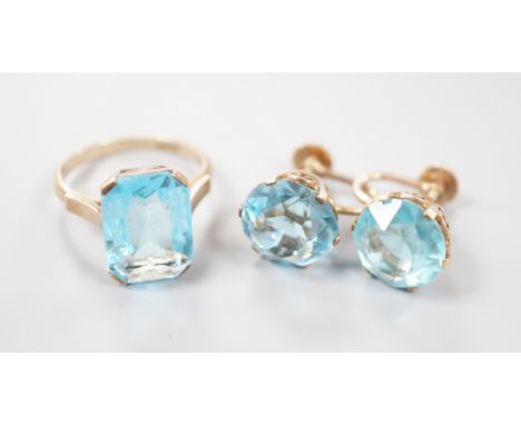 A 14k yellow metal and synthetic spinel set dress ring and a pair of similar ear clips, gross weight 10.3 grams.