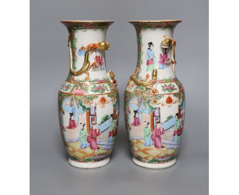 A pair of 19th century Chinese Canton ceramic vases, 25.5cm tall