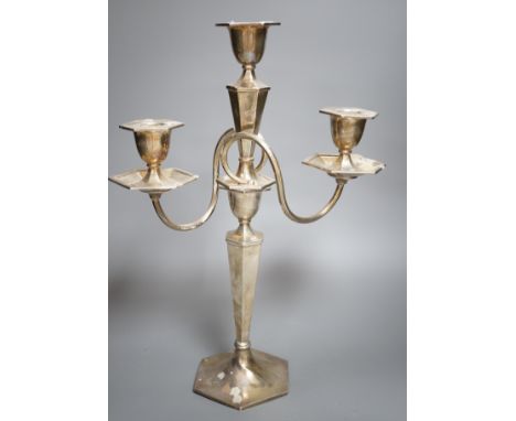 A George V silver two branch, three light candelabrum, marks rubbed, height 39cm, weighted.