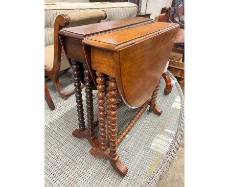 A near pair of Victorian mahogany bobbin turned Sutherland tables, width 60cm, depth 13cm, height 60cm