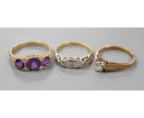 An 18ct and illusion set three stone diamond ring, gross 2.8 grams and two 9ct and gem set rings including amethyst and diamo