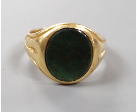 A late Victorian 18ct gold and oval bloodstone set signet ring, size O, gross weight 6.9 grams.