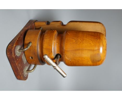 A Vintage turned mahogany hat stretcher