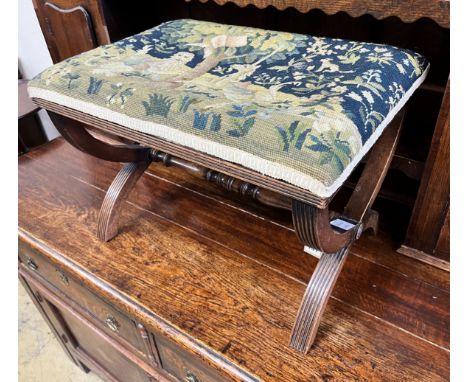 A Regency style mahogany X framed stool, upholstered with a fragment of 17th century Aubusson tapestry, height 40cm