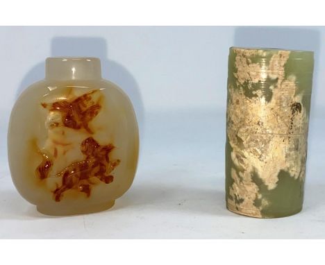 A Chinese jade coloured cylindrical item with hole to middle and a carved hard stone snuff bottle (no lid)good condition