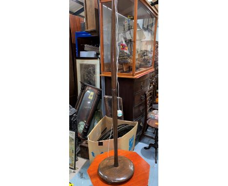 A turned wood standard lamp; a needlework firescreen; a footstool 
