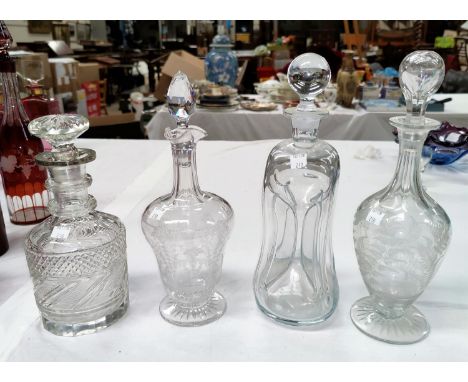 A mallet shaped cut decanter with silver rim; an hourglass decanter; 2 Victorian etched decanters 