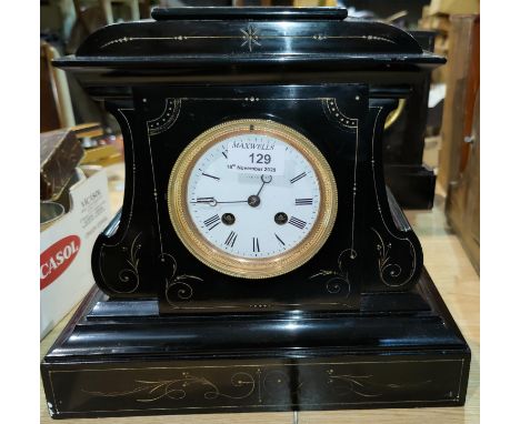 A 19th century mantel clock with French striking movement in black and variegated marble architectural case 
