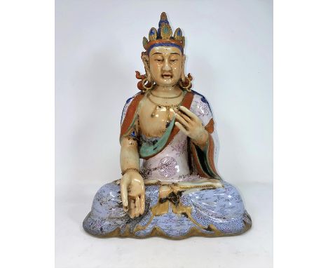 A Chinese ceramic figure of a seated buddha in Lots position, height 30cm(In good condition with possible minor repairs to he