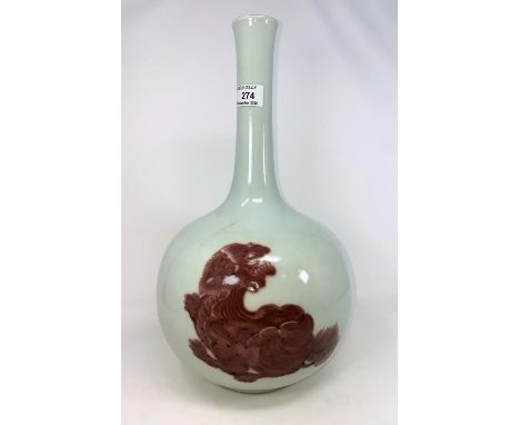 A Chinese ceramic slim neck bottle vase decorated with red glaze temple dogs, height 40cm (chipping and hairlines to neck rim