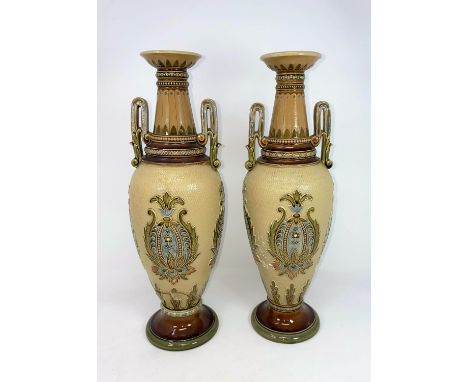 A pair of Mettlach stoneware baluster vases with Art Nouveau decoration against a light brown ground, height 34 cm (1 repaire