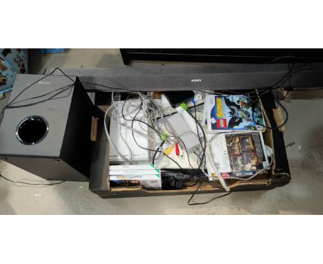 A wii games console and games; a sound bar and speaker 