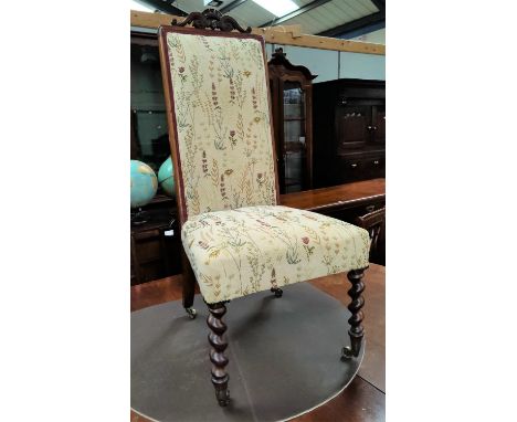 A 19th century rosewood high back chair with later tapestry pattern upholstery, on barley twist front legs and pelmet to the 