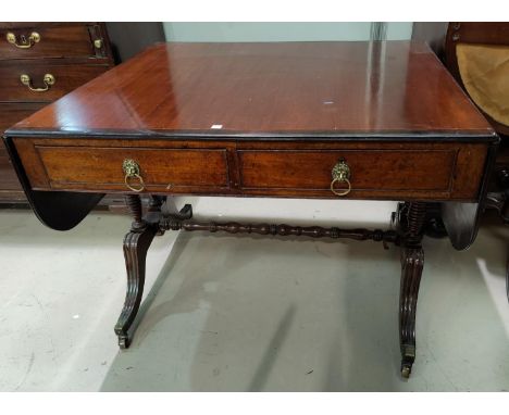 A 19th century crossbanded mahogany sofa table with frieze drawers, turned ringed end supports terminating in 4 reeded splay 