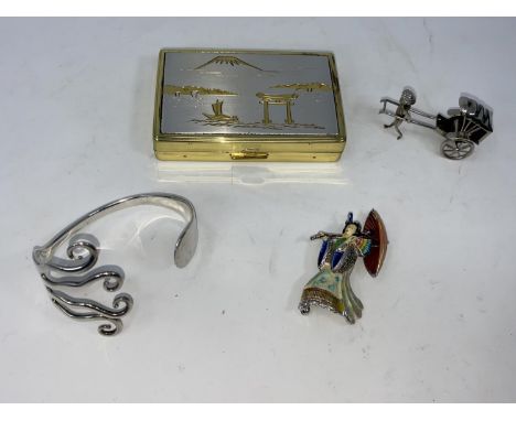 A hallmarked silver bangle; a brooch in the form of a Japanese geisha; a Japanese musical box; etc. 