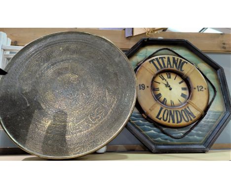 An Indian table with brass top; a Titanic lifeboat clock 