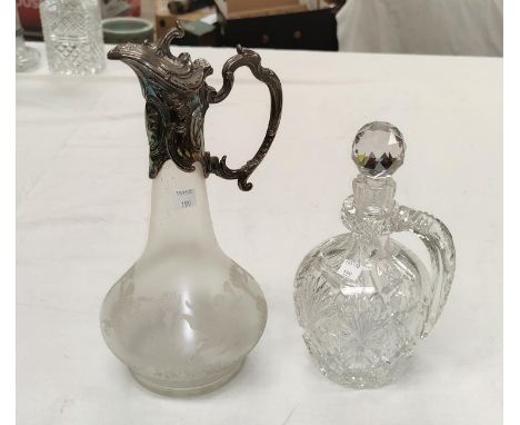 A Victorian frosted glass decanter of swelling form with silver plated embossed lid, collar and handle; a cut glass claret ju