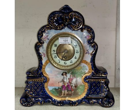 A 19th century mantel clock with French movement, in ornate china case with vignette of Charles I 35 x 34 x 12cmin good condi