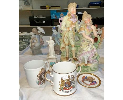 A 19th century continental bisque group:  couple in 18th century dress 