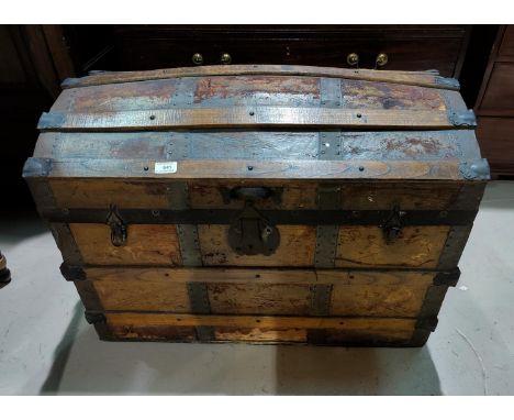 A dome top cabin trunk 