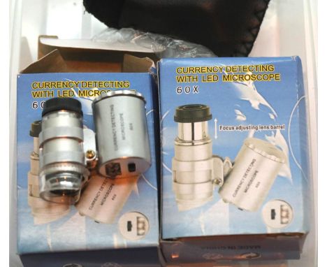 Two boxed 60x jewellery/currency detecting loupes with LED light. P&amp;P Group 1 (£14+VAT for the first lot and £1+VAT for s