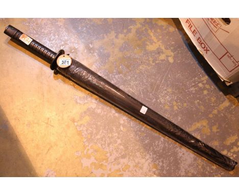 Gents black handled samurai sword type umbrella in sleeve. P&amp;P Group 3 (£25+VAT for the first lot and £5+VAT for subseque