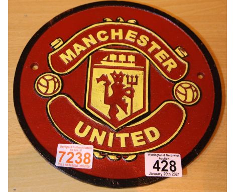 Cast iron Manchester United sign, D: 24 cm. P&amp;P Group 1 (£14+VAT for the first lot and £1+VAT for subsequent lots) 