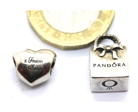 Two genuine Pandora sterling silver charms stamped ALE. P&amp;P Group 1 (£14+VAT for the first lot and £1+VAT for subsequent 