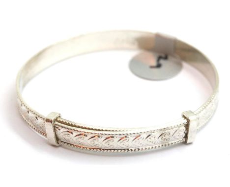 Silver vintage heart engraved adjustable baby bangle, stamped 925. P&amp;P Group 1 (£14+VAT for the first lot and £1+VAT for 