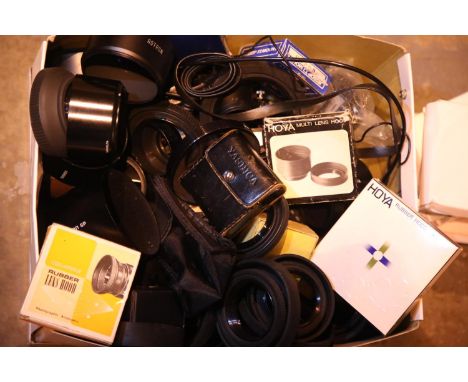 Large quantity of camera lens hoods, filters and other accessories including Hoya, Tamron, Sigma and Yashica. P&amp;P Group 2