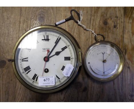 A 19th century brass aneroid barometer with thermometer, and a Smiths Astral brass bulkhead clock (2)   Condition report  Rep