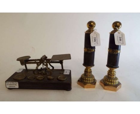 A set of S Mordan & Co brass postal scales, with weights, 20.5 cm wide, and a pair of brass and composition stands, 21.5 cm h