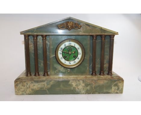 A mantel clock, in an architectural green marble type case, 30.5 cm high, a black slate mantel clock, a similar case, another