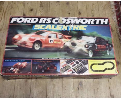 A Scalextric Ford RS Cosworth boxed set, and other assorted Scalextric accessories (3 boxes)