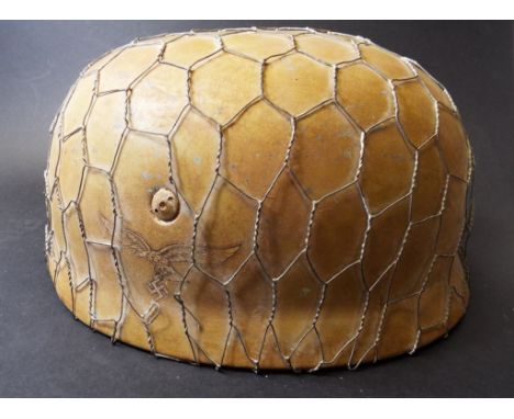 A German paratrooper style helmet   Condition report  ReportOf post war constructionReport by GHThe helmet has a leather line