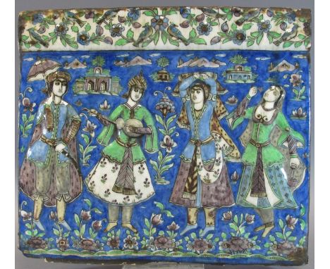 A QAJAR MOULDED TILE DEPICTING REVELLERS Probably Teheran, Persia, Second half 19th century polychrome-glazed fritware, of re