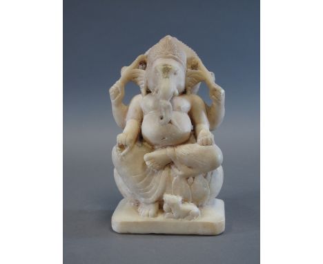 A MARBLE FIGURE OF GANESHA Rajasthan, Western India, 19th century the four-armed elephant headed deity seated on a lotus, his