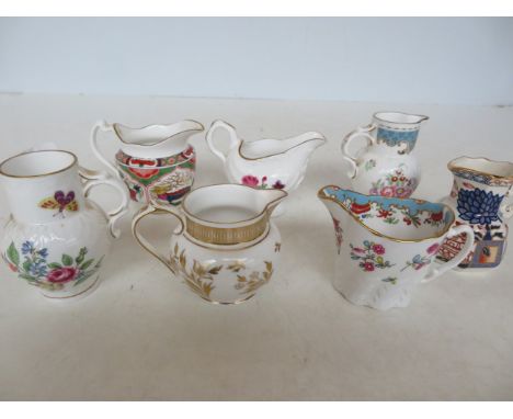 Collection of 7 Royal Worcester jugs Tallest  cm 