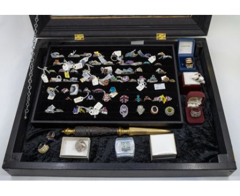 A collection of silver stone set dress rings, in various styles, including precious stone examples, including topaz, quartz, 