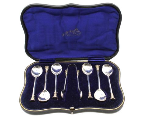 A cased set of six George V silver seal top spoons and matching pair of sugar tongs, hallmarked by Thomas Bradbury & Sons, Sh