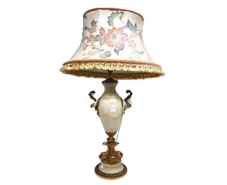 A large ornate 20th century alabaster lamp base with gilt metal ormolu design of fishes to stem and handles, with shade, elec