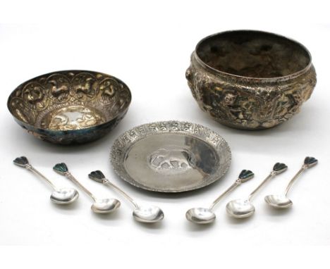 An Indian white metal bowl, heavily decorated with embossed figures and foliage, marked with script to base, approx. 11.5cm d