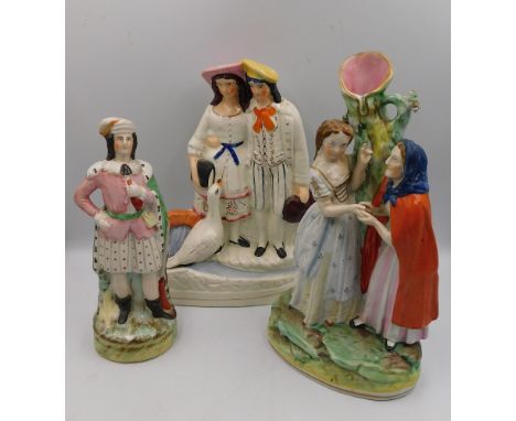 A Staffordshire spill holder figure of The Fortune Teller, Circa 1850, Size 31cm high. Condition: Tellers head scarf repainte