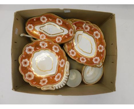 A Spode part dinner service , circa 1800 - 1820, decorated with stylised white flowers on a bright orange ground with gilt vi