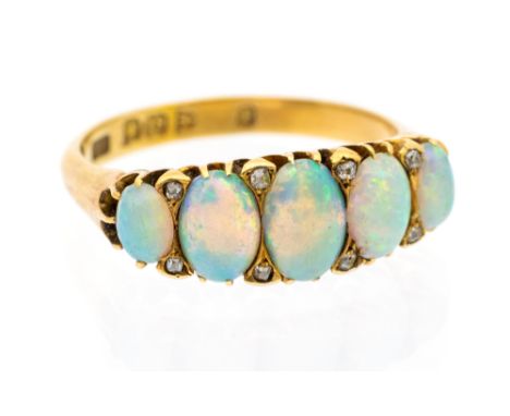 An opal and diamond set 18ct gold ring, comprising five graduated oval cabochon opals, with small diamond set accents, with a